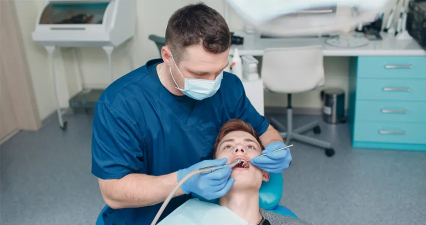 dentist performs root canals